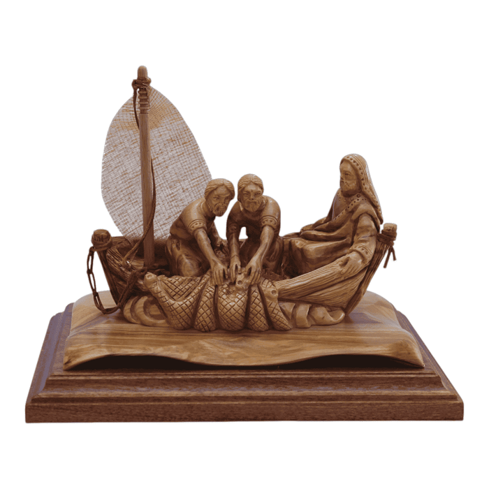 a wood carving of the biblical story " miraculious Fishing in the Sea of Galile" handmade in Bethlehem from olive wood 